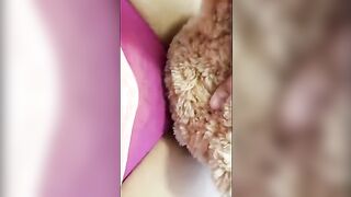 A girl is fucking with a bear made of plush and she is very horny
