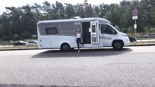 Public sex on the A1 motorway in wet look leggings, getting drenched completely
