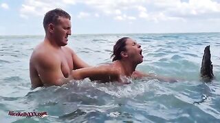 A couple has an amazing and passionate sex in the blue lagoon