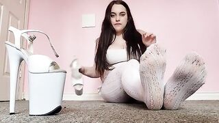 Exclusive foot fetish content with a sexy brunette in white tights, showcasing her petite feet in a tantalizing solo performance