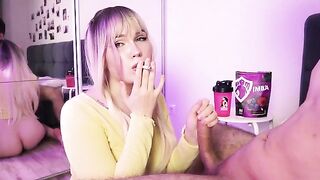 A cute girl smokes a cigarette or sucks a cock, depending on her mood