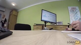 A business lady is trying to get some money from the bank by any means
