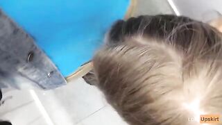 The petite girl was almost caught while giving a blowjob in a shop changing room
