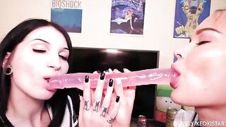 Two sexy lesbian babes playing with their pussy using a dildo in steamy action