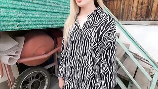 The beautiful hostess received a discount from the employee, showcasing sensual glamour