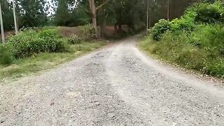 A beautiful brunette takes a bike ride through the forest and meets a friend