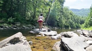 An amateur couple engaged in real sex right in the river, on a hike