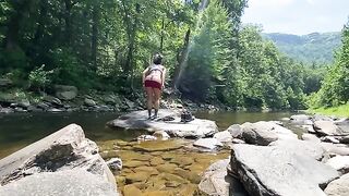 An amateur couple engaged in real sex right in the river, on a hike