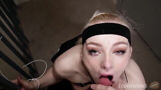 A cute girl with blue eyes is deeply engaged in oral play outdoors