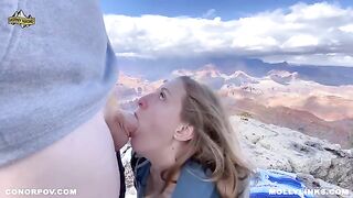 A couple enjoys passionate sex right on top of a cliff after hiking