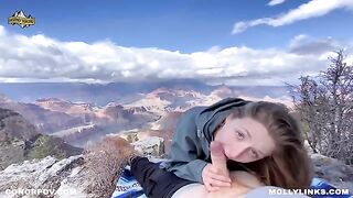 A couple enjoys passionate sex right on top of a cliff after hiking