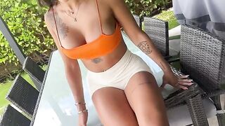 A photographer, taking kinky oil pictures of his model Sisi Rose in public