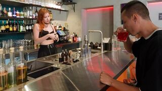 The hot bartender served not only drinks, but also offered a special service to the customer