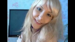 Blonde plays with her pussy with gentle fingers
