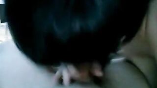 A drunk brunette woman gave a blowjob to her husband, unbuttoning her pants