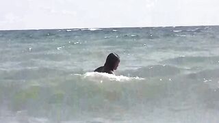 Nude girls are basking in the sun on the beautiful beach
