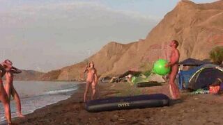A naked game of badminton on the nudist beach