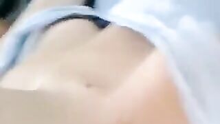 A half-naked lie and caress her body with her hands
