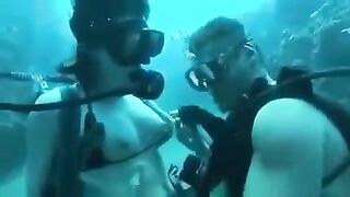 Underwater sex of two aqua sexy girls at the bottom of the sea