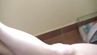 A naked girl has a small fire on her breasts