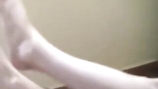 A naked girl has a small fire on her breasts