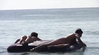 Nude beauties have fun on the sandy beach