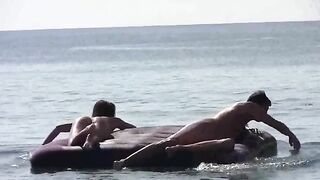 Nude beauties have fun on the sandy beach