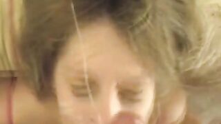 A cum shot on the girl's face after a blowjob