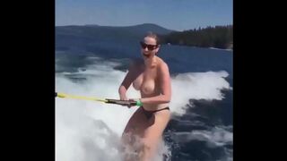 Topless girl skiing on the water surface, a thrilling sight!