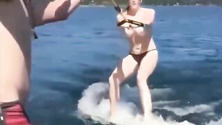 Topless girl skiing on the water surface, a thrilling sight!