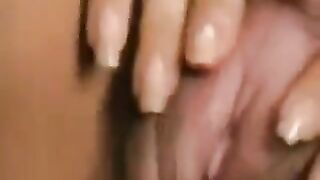 A girl with a big clitoris gets her hairy cunt played with