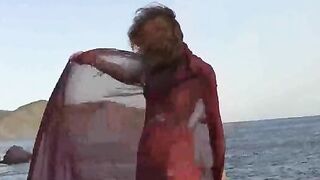A girl with small boobs gets them wet in the rain