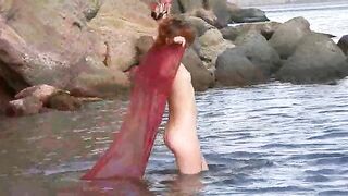 A girl with small boobs gets them wet in the rain