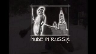 Nude girls are having fun with snowballs in the street