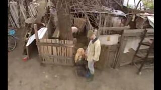 A hot slut is having fun with a guy in the Russian village