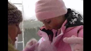 Two girls are having fun at home because of the cold weather