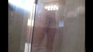 A man washes himself in the shower, but there's a camera