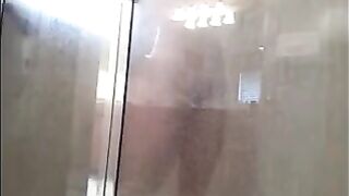 A man washes himself in the shower, but there's a camera