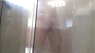 A man washes himself in the shower, but there's a camera