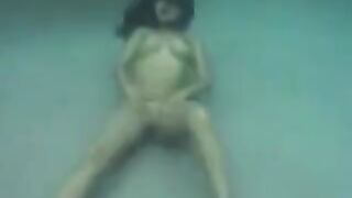 Underwater sex adventure with busty brunette in the ocean, featuring big tits action