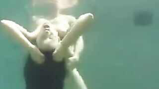 Underwater sex adventure with busty brunette in the ocean, featuring big tits action
