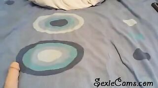 Girl checks out her new toy and tests it in front of a webcam
