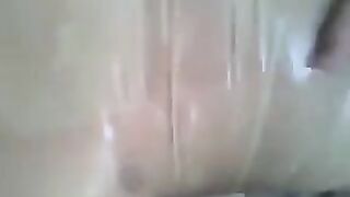 A guy put a condom on his dick and jerked it