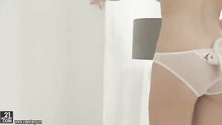 A blonde beauty plays with her hairy pussy using a sex toy