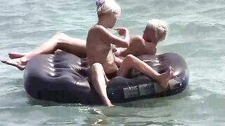 A naked girl is having fun on the mattress in an intimate scene