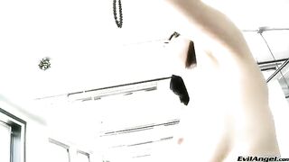 A cute girl plays with balls and vagina in high heels