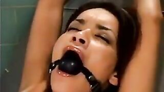 A bald guy forced sex on a girl with the help of a machine