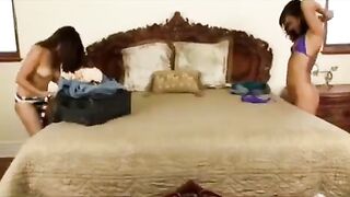An Asian girl gets her pussy licked by a passionate brunette on the bed
