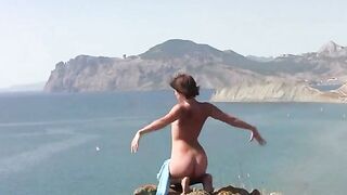 A girl is showing her body on the beach without any clothes