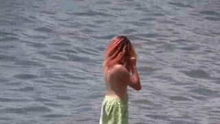 A hot nudist is walking along the coast of Crimea in HD